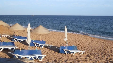Umbrellas on beautiful summer beach Video stock 116726016