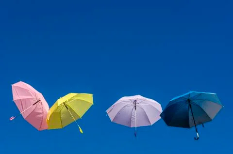 Umbrellas colored in the blue sky Stock Photos