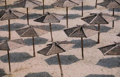 Umbrellas on the Empty Beach Stock Photos