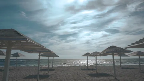 Umbrellas on the empty closed beach during coronavirus pandemic time Video stock 161163549