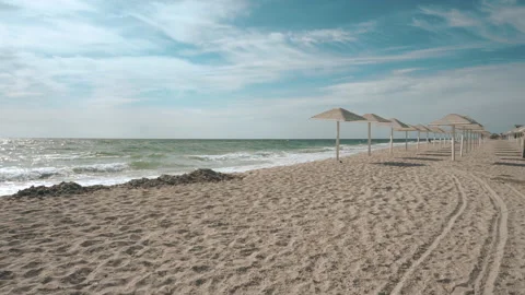 Umbrellas on the empty closed beach during coronavirus pandemic time Stock Footage 161163622