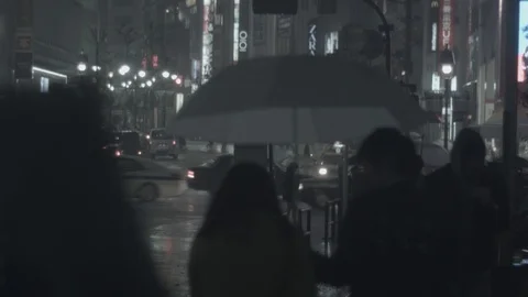 Umbrellas in the rain in Shibuya (log) Stock Footage 126936070