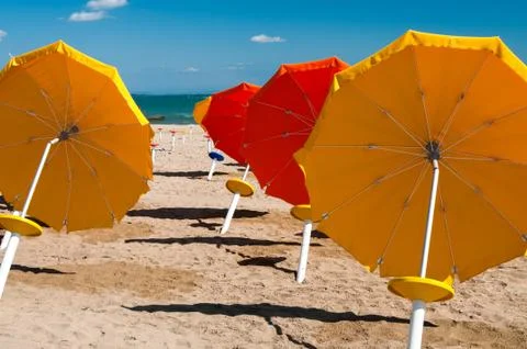 Umbrellas on Sandy Beach Stock Photos