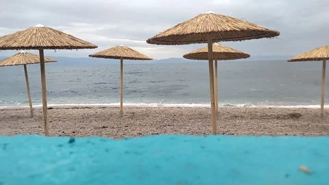 Umbrellas on the seashore Video stock 308632114
