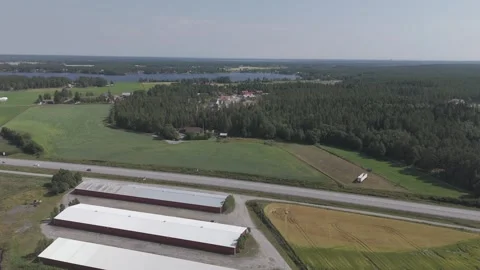 Umeå Countryside Drone Over E4 with Rolling Fields and Road 스톡 동영상 314228559