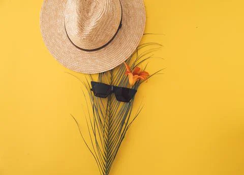 Ummer background with straw hat and bag and palm leaves Stock Photos