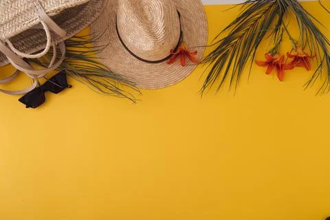 Ummer background with straw hat and bag and palm leaves Stock Photos