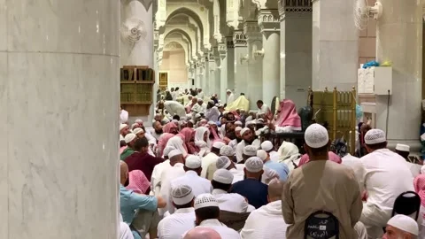 Umrah pilgrims attending an Islamic lecture Stock Footage 332593527