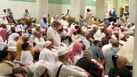 Umrah pilgrims attending an Islamic lecture Stock Footage 332593528