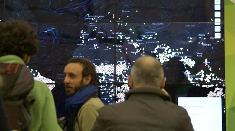 UN Climate Change COP21 delegates view data visualization map Stock Footage 59219457