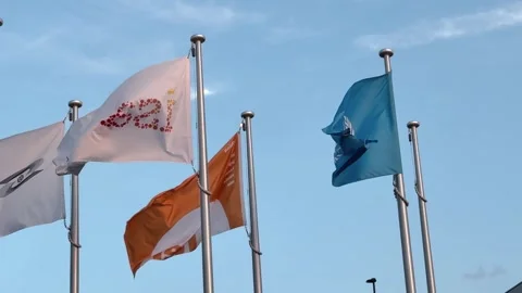 UN, ITER, and ISA Flags Fluttering Together at Expo 2025 Osaka Stock Footage 320978841