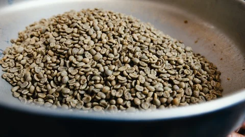 Un-roasted Coffee Beans Going into Roaster Stock Footage 123729663