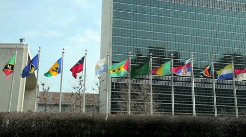 UN United Nations NY New York headquater tight pan flags Stock Footage