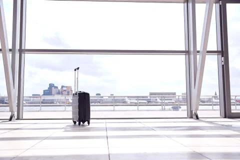Unattended Suitcase Posing Security Threat In Airport Building Stock Photos