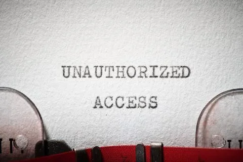 Unauthorized access text written with a typewriter. Stockfoto's