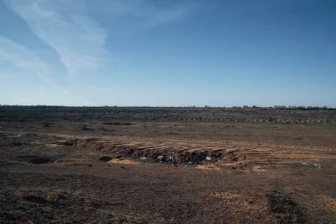 Unauthorized dumping of garbage in the steppe.Environmental disaster Stock Photos