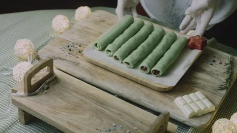 Unbaked cherry rolls and red topper arranged on a tray Stock Footage 342129021