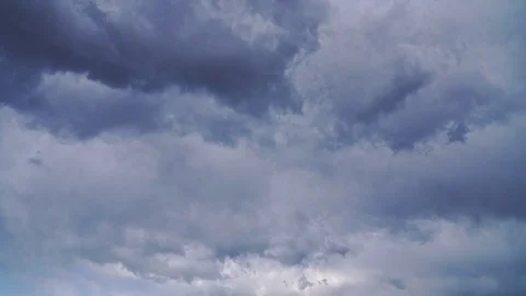 Unbelievable huge thunderstorm clouds fly fast in the sky Stock Footage 105350004