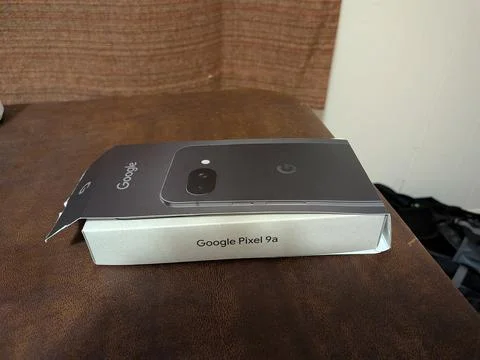 Unboxed Google Pixel 9a smartphone retail packaging Stock Photos