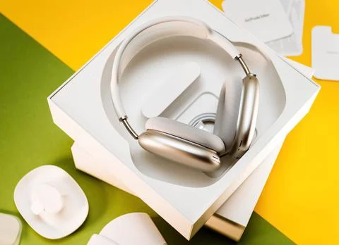 Unboxed new silver Apple Computers AirPods Max over-ear headphones on the wooden 写真素材