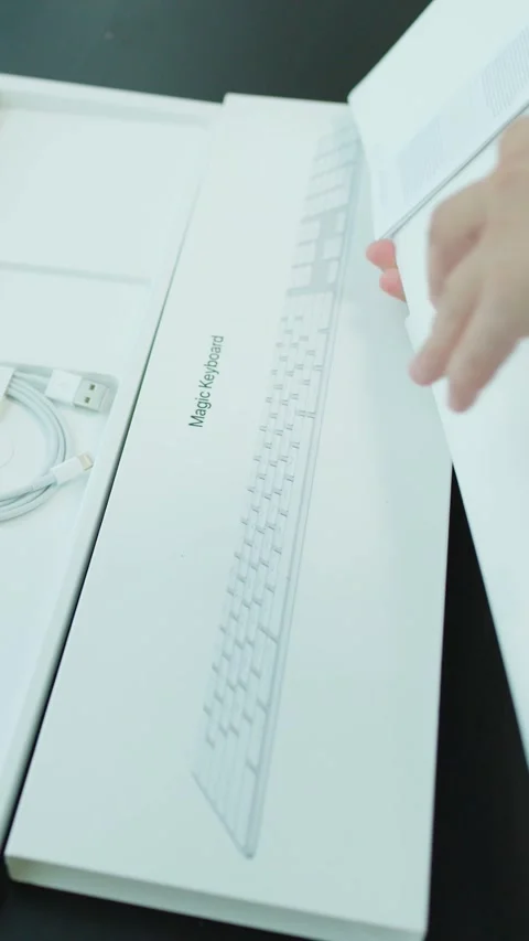 Unboxing and Setting Up a Wireless Computer Keyboard Stock Footage 323339530