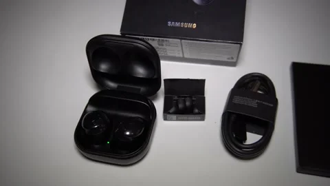 Unboxing Buds Pro. Slide Camera. Stock Footage 151000612