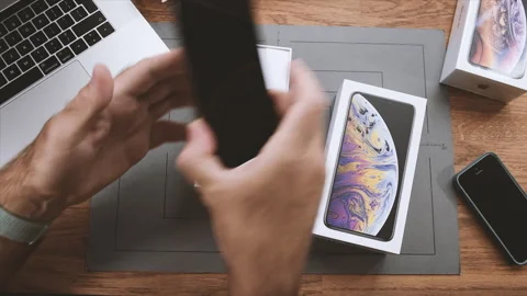 Unboxing in creative environment room table new latest Apple Computers Stock Footage 250050049