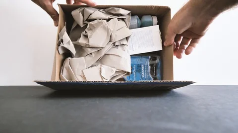 Unboxing parcel with Amazon products for the car and home clean Stock Footage 95207995
