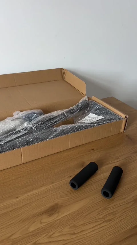 Unboxing Wall-Mounted Pull-Up Bar Stock Footage 311021581