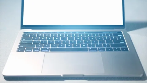 Unbranded Modern Laptop Computer Bright White Screen Monitor Lens Flare Stock Footage 85619259
