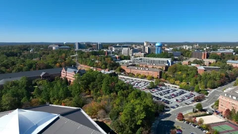 UNC Chapel Hill campus revealing Dean E. Smith Center for basketball on Stock Footage 257514466