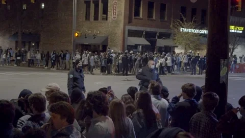 UNC Students Rush Franklin st after Duke Victory during COVID - Slow Motion Video stock 149930266