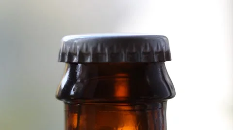 Uncapping bottle of beer,  macro shot ( HD, high definition 1080p) Stock Footage 42096072