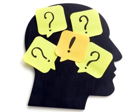 Uncertainty, thoughts and creativity. Head shape with question marks. Stock Photos