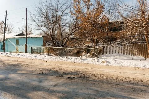 Uncleaned roads after a winter snowfall in Kazakhstan. highway covered with Stock Photos