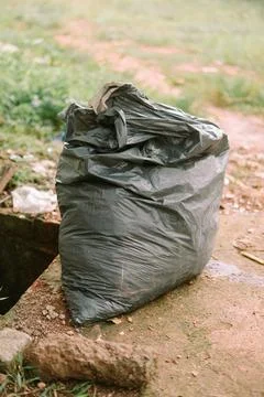 Uncollected garbage bag, polluting the environment and creating problems Stock Photos