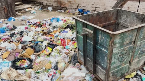 Uncollected Garbage Scattered Around Waste Container As An Urban Sanitation.. Stock Footage 345948900