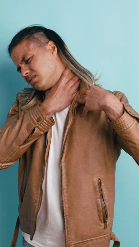 Uncomfortable man suffering from a severe sore throat. Vertical Stock Footage 339325964