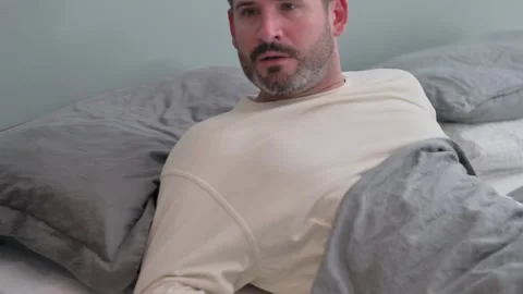 Uncomfortable Middle Aged Man Having Nightmare while Sleeping in Bed Stock Footage 287899229
