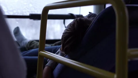 Uncomfortable sleeping on the bus Stock Footage 256850887