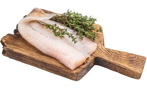 Uncooked Atlantic cod fillet, raw fish ready to be seasoned and transformed.. Stock Photos