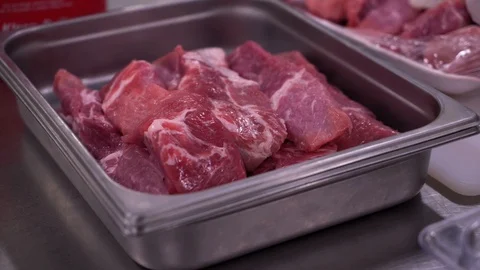 Uncooked beef in pan Stock Footage