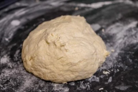 Uncooked bread dough on a kitchen surface 库存照片