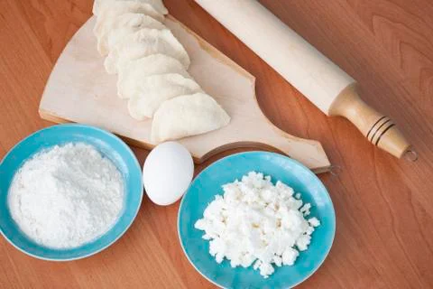 Uncooked dumplings on the cutting board Stock Photos