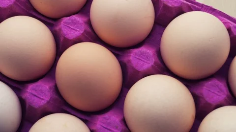 Uncooked eggs. Rotating and closeup. Nobody Stock Footage 97936878