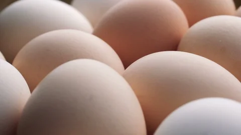 Uncooked eggs. Rotating and closeup. Nobody Stock Footage 97937425