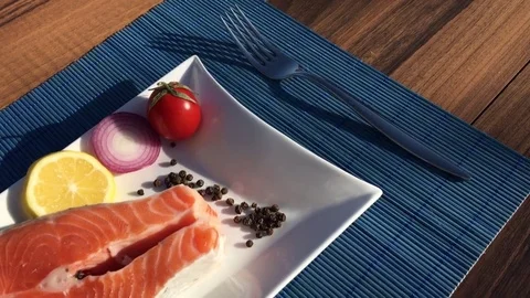 Uncooked Fresh Salmon and red tuna Fish pieces Served over Plate Board Stock Footage 70973111