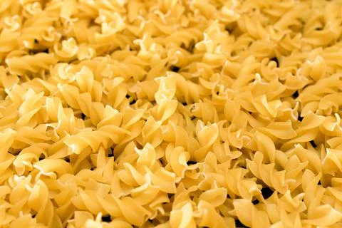 Uncooked Fusilli Pasta - Texture Background Stock Photos