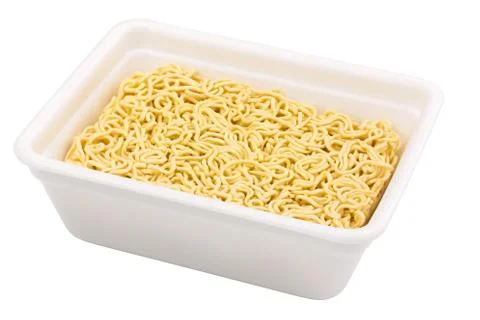 Uncooked instant noodle in rectangular cup Foto stock