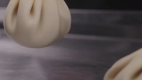 Uncooked khinkali dumplings lying on the table close-up. Stock Footage 313981518